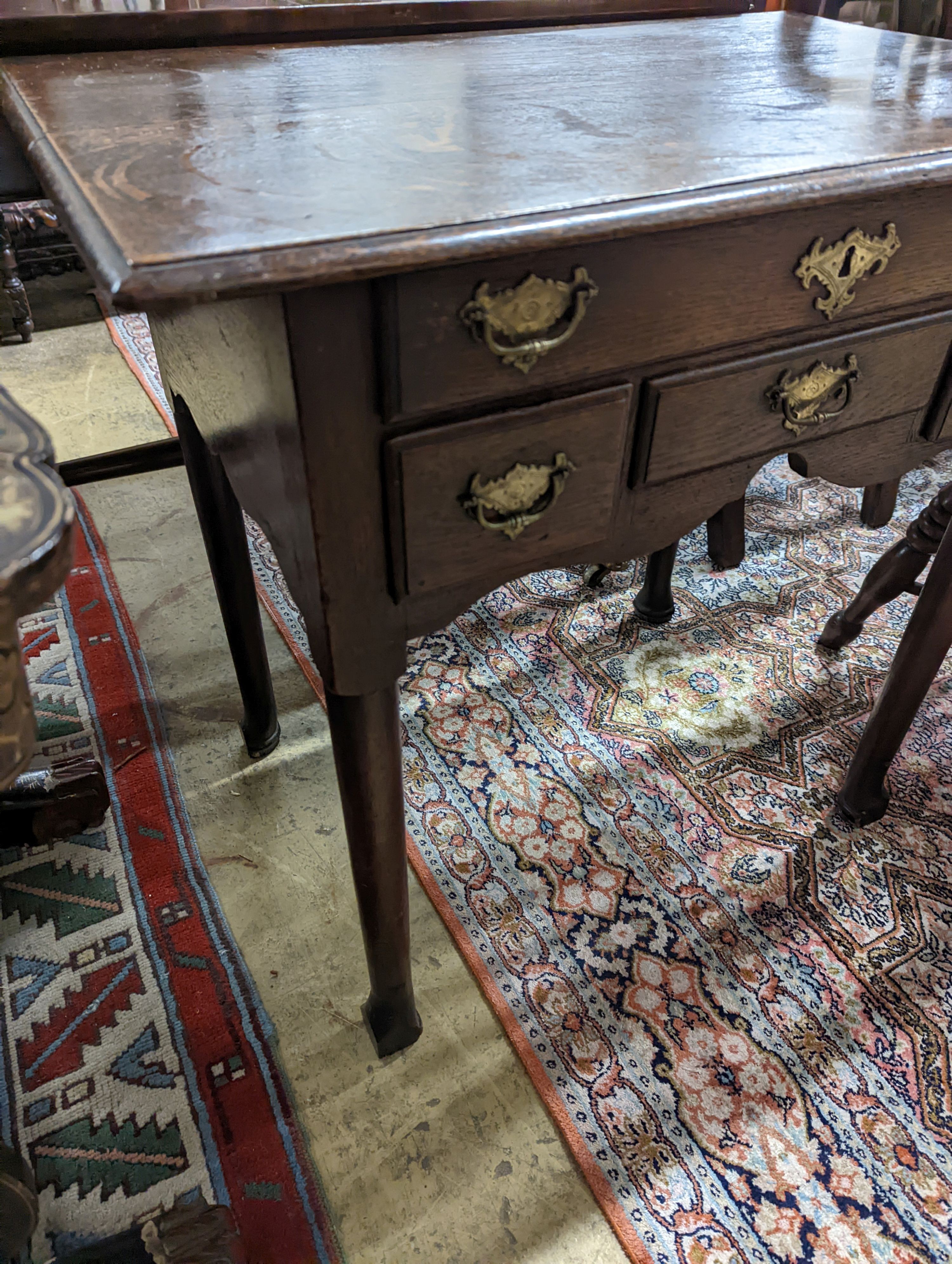 An 18th century oak lowboy. W-74cm, D-49cm, H-70cm.